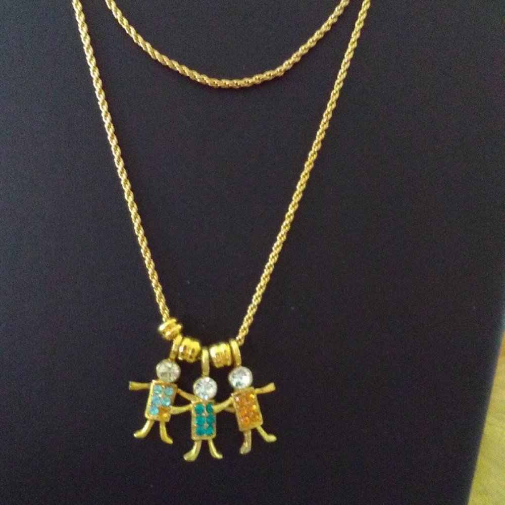 Vintage 29" Monet gold tone rope chain with 3 KIS USA child charms & 3 spacers
